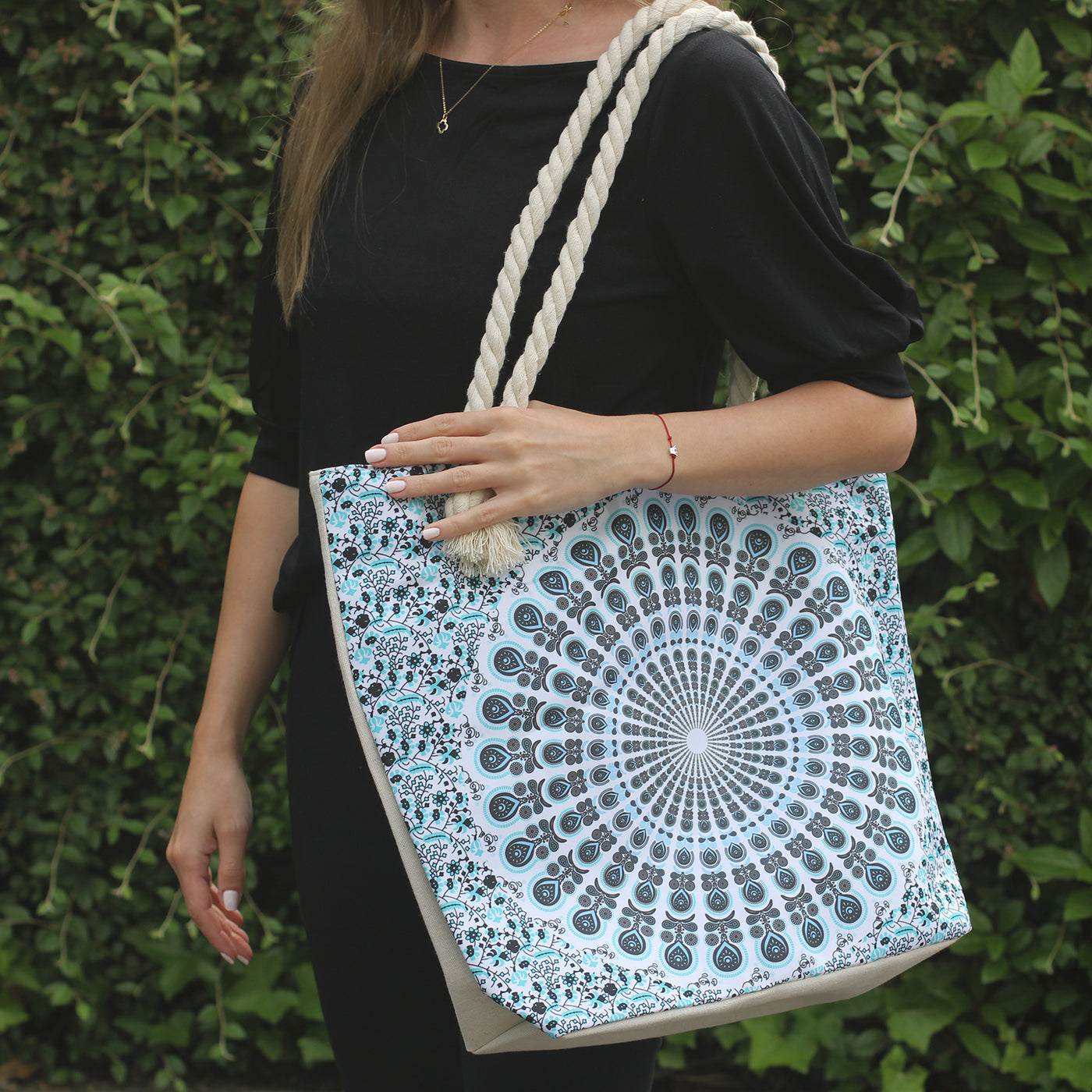 This charmingly patterned Mandala Bag is large enough for storing all of your essentials. It has small pocket inside, two shoulder straps and fastening at the top with a zip. It will be perfect for shopping and also for a beach.